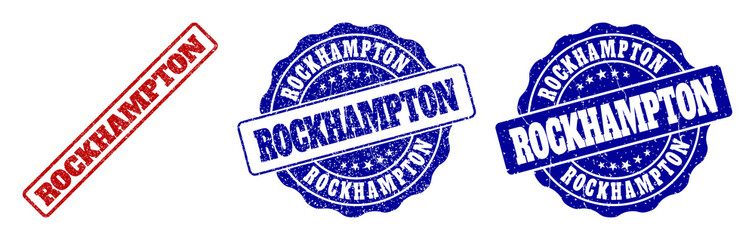 ROCKHAMPTON scratched stamp seals in red and blue colors. Vector ROCKHAMPTON watermarks with grunge effect. Graphic elements are rounded rectangles, rosettes, circles and text labels.