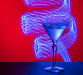 martini glass, red background