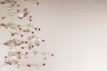 Beautiful colorful strass garland decoration on silver background.