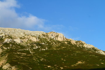 Fototapeta premium fantastic mountain cliff with blue sky, natural landscape photo