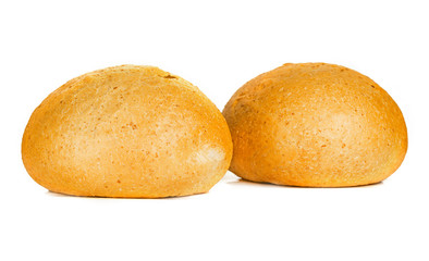 two rounded buns of isolate on a white background. Two fresh baked buns on a white background