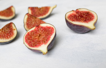Fresh fig. Fruit with half and quarter on light background. Collection.