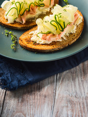 Rye bread toasts with cheese, ham, cucumber