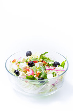 Salad from vegetables and olives. Salad in a transparent bowl. Salad isolate.