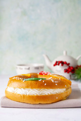 Roscón de reyes. Christmas cake with cream and tea