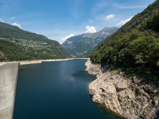 Obraz na płótnie Canvas Amazing dam of Contra Verzasca Ticino, Switzerland. The dam creates a water reservoir Lago di Vogorno. Place for bungee jumping and where some scenes of James Bond movie was taken place. August, 2018