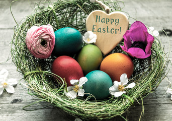 Frohe Ostern, Osternest mit bunten Ostereiern und Herz - Happy Easter,  Easter nest with colorful Easter eggs and heart