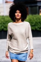 Portrait of attractive afro woman in the street