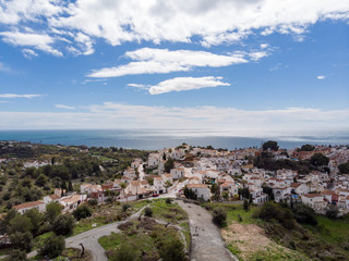 Fototapeta na wymiar Panorama aerial view of white color houses and Mediterranean architecture in Nerja, Malaga Province, Andalusia, Spain. March, 2018