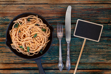 Whole wheat pasta or spaghetti dish with copy space