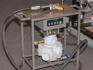 The gun of a gas station for pumping fuel into the car tank
