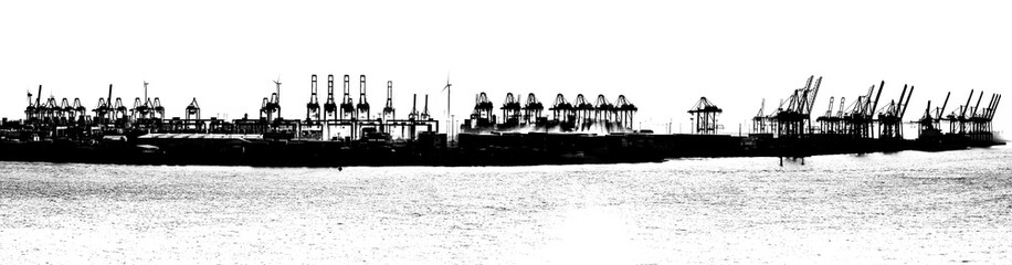 Silhouette of cranes in Hamburg Harbor, Germany. Panorama  in black and white.