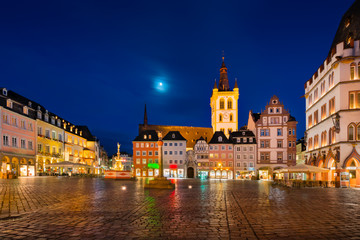 Fototapeta na wymiar The Main Market of Trier, Germany at night. It is the center of the medieval Trier surrounded by numerous historic buildings.