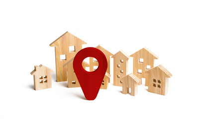 Wooden city and houses location sign. concept of rising prices for housing or rent. Growing demand...