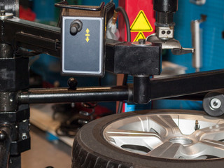 Stand for disassembly and balancing of automobile wheels