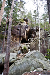 Fototapeta na wymiar Dovbush rocks in green forest at Carpathian mountains.
