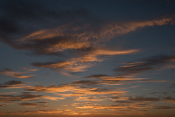 Fototapeta na wymiar Dramatic burning sky during sunset with blue background, Poland