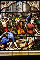 Fototapeta na wymiar Lapidation de Saint Etienne, vitrail de l'église Saint Seine à Corbigny, Bourgogne