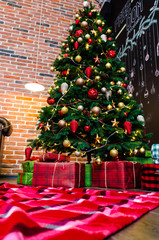 New year tree with gifts at home