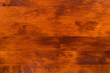 Dark red wood as a background.
