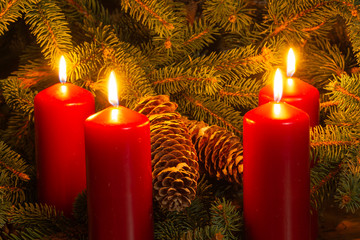christmas candles on red background
