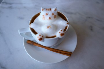 Cute cat cappuccino or latte coffee art 3d on the marble table background
