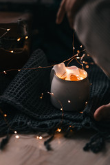 burning candle on black background