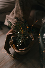 woman holding a pine tree