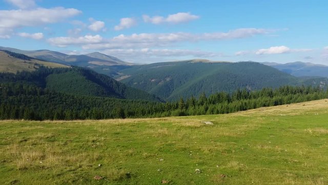 Panning footage of a panoramic view of Parang Mountains in Romania, Europe.