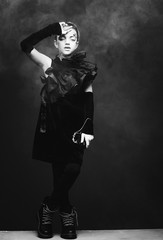 Beauty and fashion concept: Little girl wearing black outfit. Creative make up.