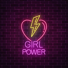 Girls power sign in neon style. Glowing symbol of female slogan with heart and lightning shapes. - obrazy, fototapety, plakaty