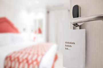 The hotel room with DO NOT DISTURB sign on the door