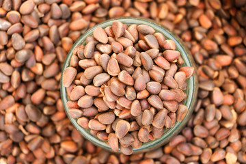 Cedar nuts in a bag. Close-up. The background is blurred.