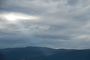 Fototapeta premium Ray of a sunlight piercing through the clouds