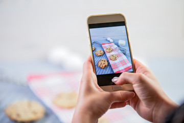 Using mobile phone to photograph the food. Photos of food for social media