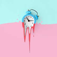 Time is running out. Melted blue alarm clock