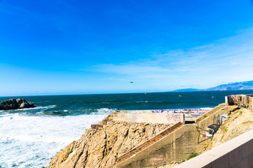 Obraz premium The view of Lands end at San Francisco- San Francisco. summer , cloud , rock , sea, plant.