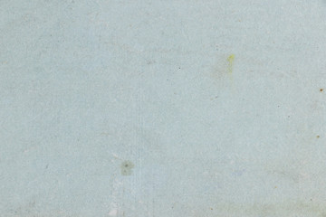 Blank cardboard and paper background. The texture of the surface of old cardboard in stains and the blank backdrop of the old book sheet. 