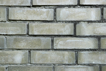Wall of gray bricks. Brickwork. Close-up.