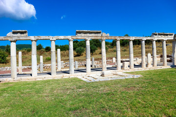Ruins of ancient greek gymnasium against blue sky, ancient Messini, Peloponnese, Greece