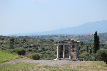 Ruins of ancient greek temple with classic greece landscape on the background, archaeological site Messini, Peloponnese