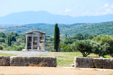 Fototapeta na wymiar Classic doric temple, mausoleum of the Saithidae, a prominent Roman family and view to the mountains, ancient Messini, Peloponnese, Greece