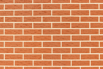 Wall of brown brick. The texture of the brickwork. Grunge background with space for text or image.