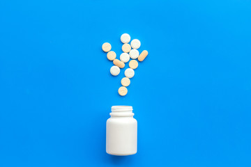 medical pills, antibiotics taking for care and health on blue background top view space for text