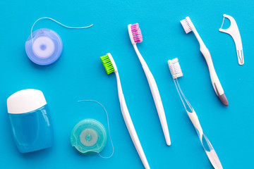 Tooth care with toothbrush, dental floss and dentist instruments. Set of cleaning products for...