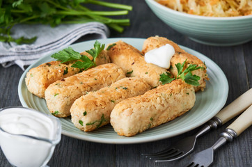 Fried sausages of boiled white beans on a plate    