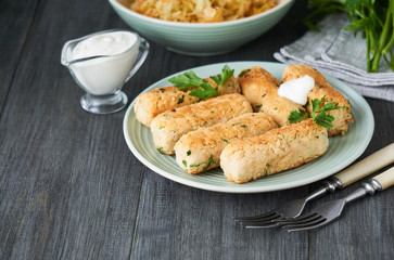Fried sausages of boiled white beans on a plate    