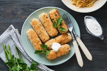 Fried sausages of boiled white beans on a plate    