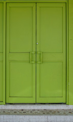 An old entrance doorway painted recently in green.