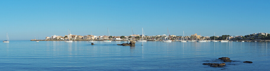Fototapeta na wymiar Colonia Sant Jordi, Mallorca Spain. View at the port and promenade during the summer season
